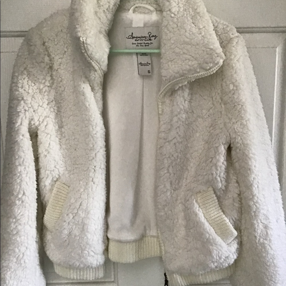 White long sleeve zip up jacket.